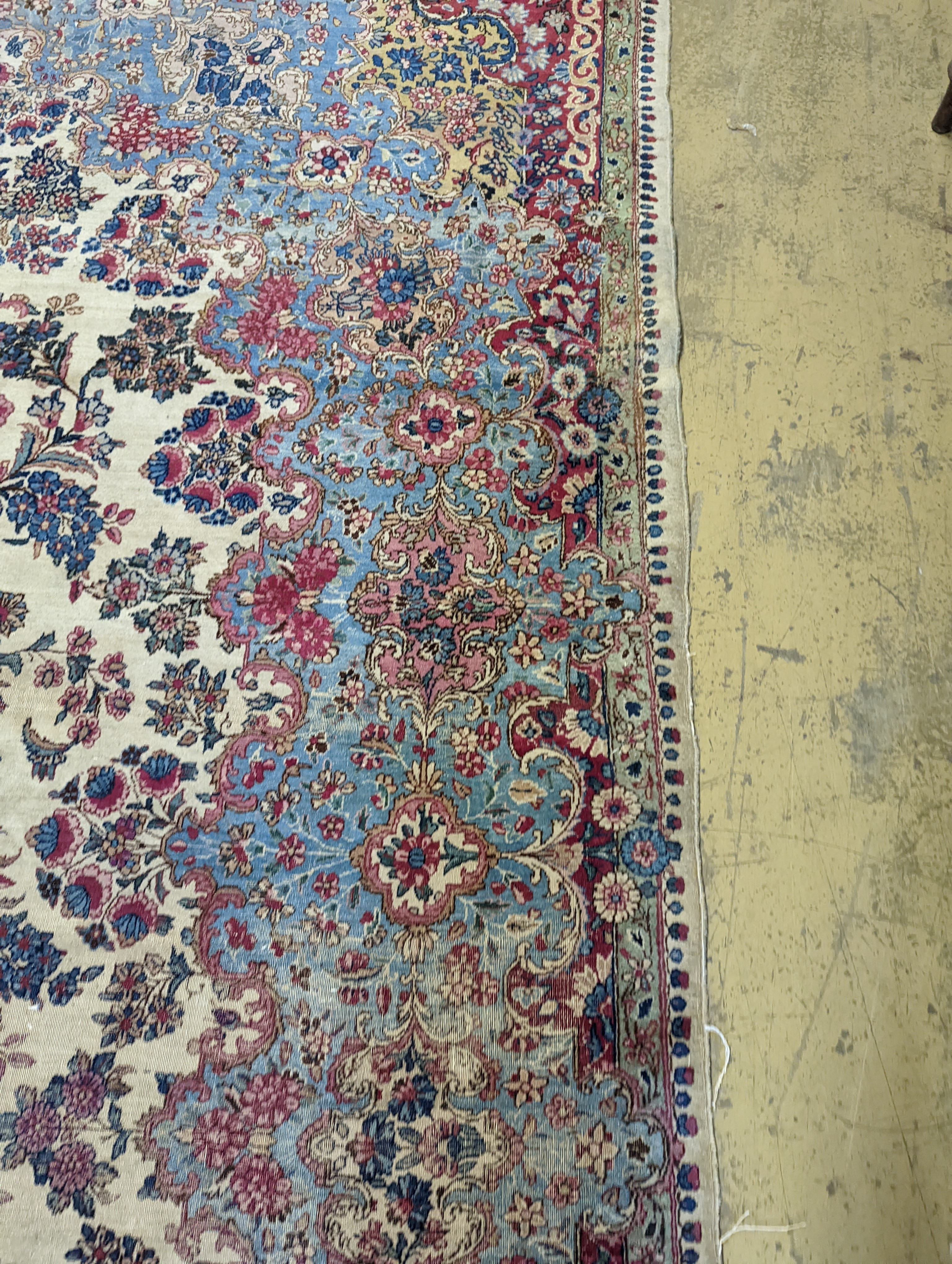 A North West Persian ivory ground carpet, 396 x 290cm
